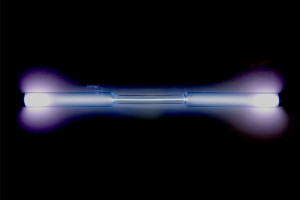 A xenon-filled discharge tube glowing light blue